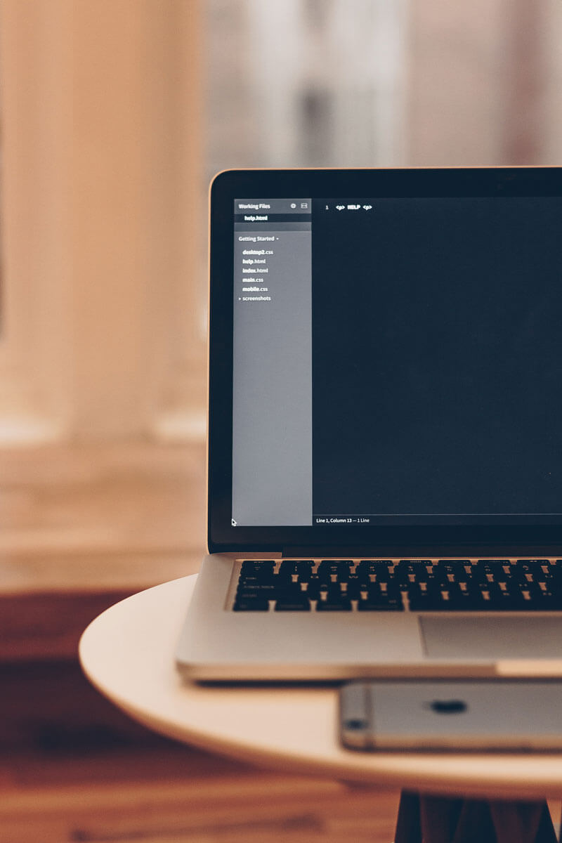 Laptop on table with phone